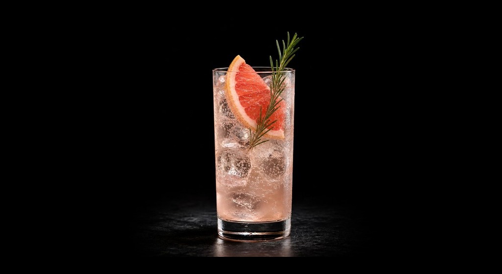 citrus tonic cocktail on a black studio background