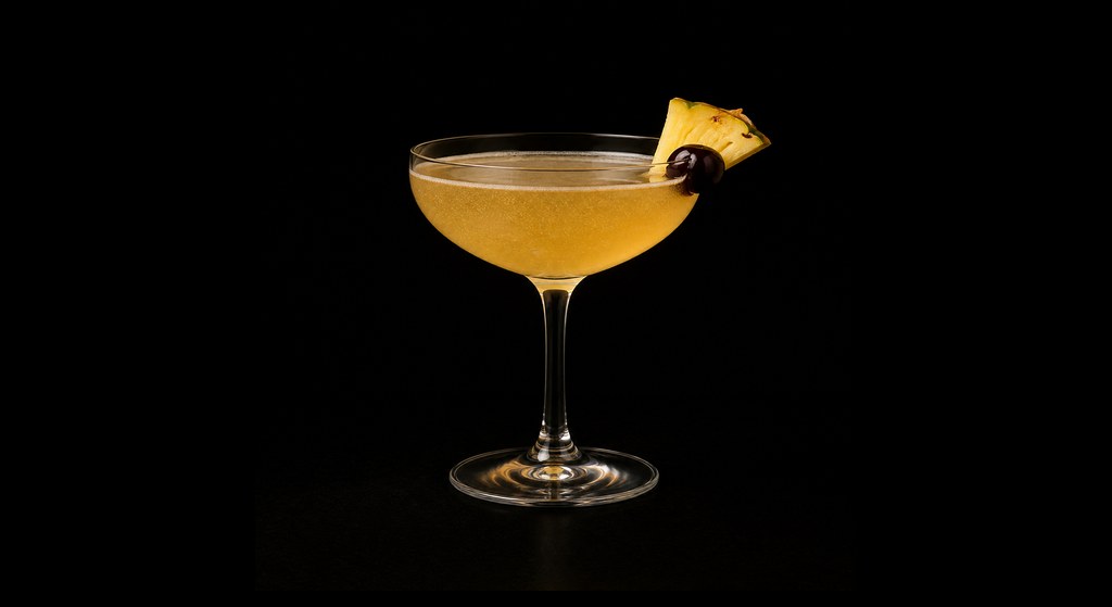 Club Cocktail (Difford's recipe) cocktail on a dark studio background