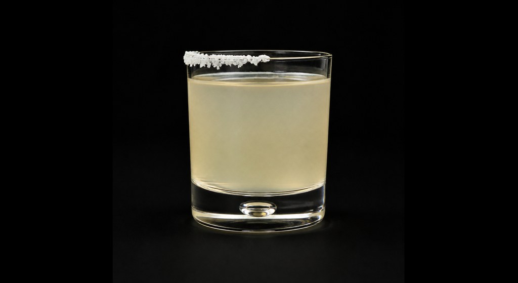 Coconut Margarita cocktail on a dark studio background