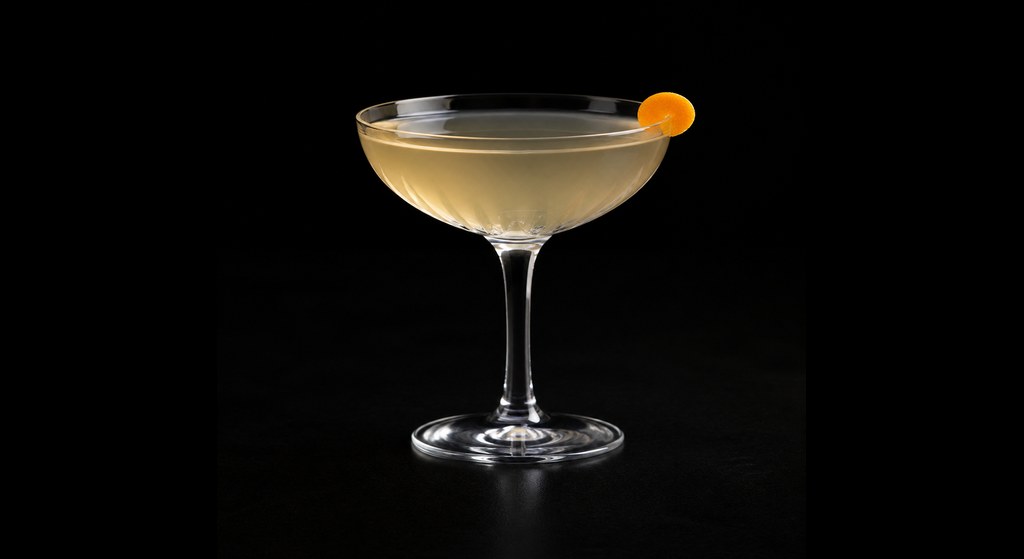 Coconut Sands Negroni cocktail on a dark studio background