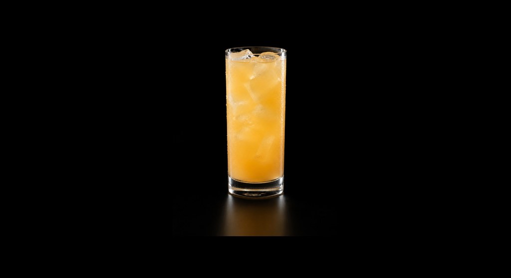 Coconut Water Citrus Mocktail cocktail on a dark studio background