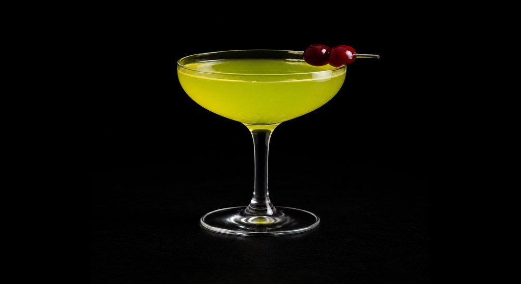 Cosmic Alaska cocktail on a dark studio background