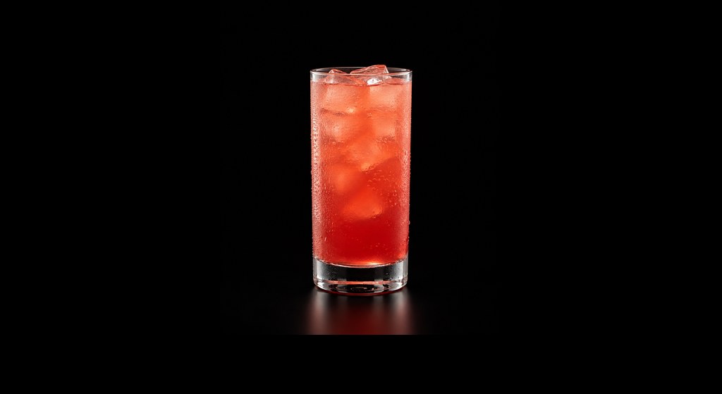 Cranberry Orange Punch cocktail on a dark studio background