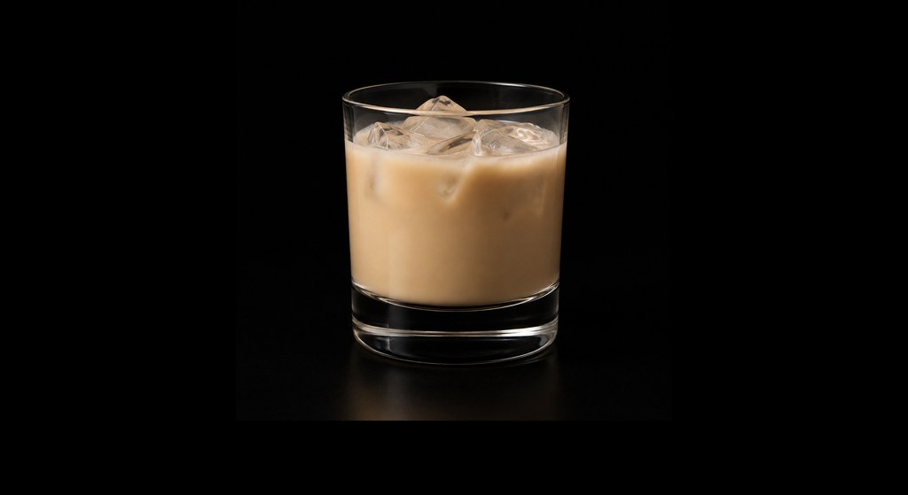 Crème de Café cocktail on a dark studio background