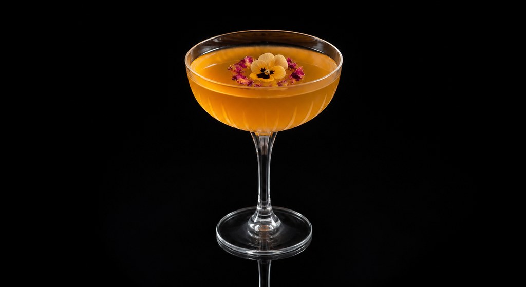 Crowned King cocktail on a dark studio background
