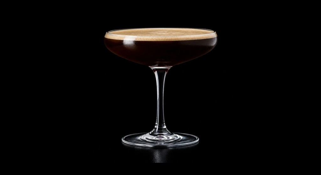 Damn Fine Coffee Martini cocktail on a dark studio background