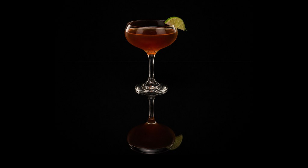 Dark Daiquiri cocktail on a dark studio background