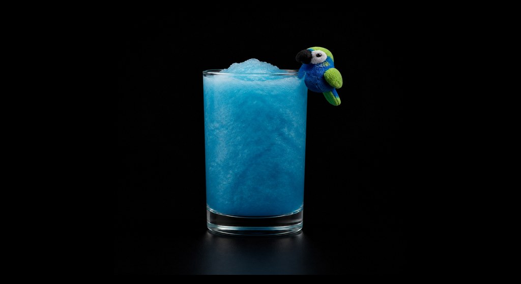 Dead Parrot Colada cocktail on a dark studio background