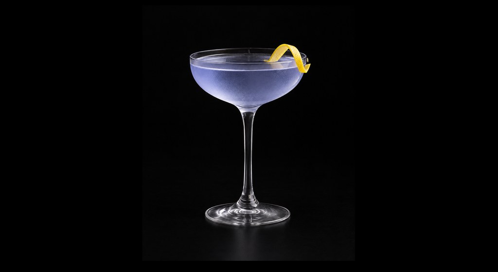 Deep Blue Sea cocktail on a dark studio background