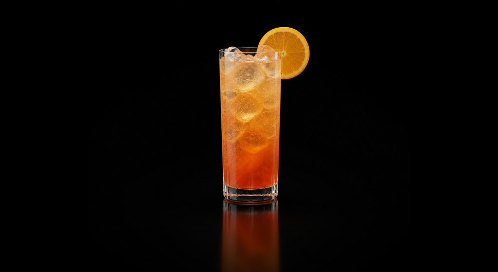 Desert Cooler cocktail on a dark studio background
