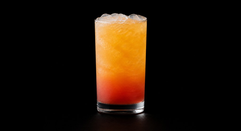 Desert Sunrise cocktail on a dark studio background