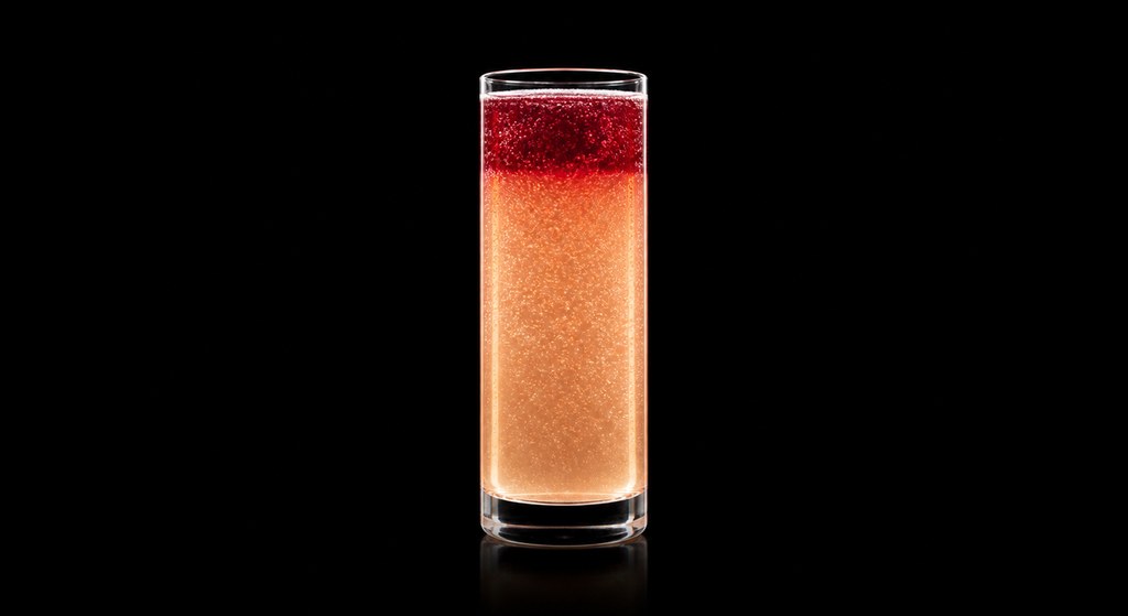 Devil In A Red Dress cocktail on a dark studio background