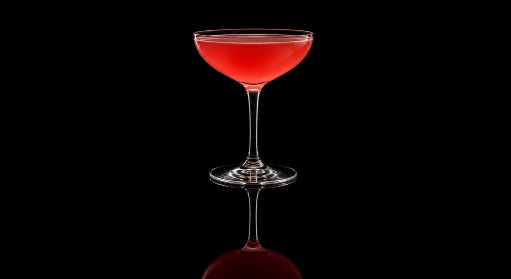 Diana's Bitter cocktail on a dark studio background