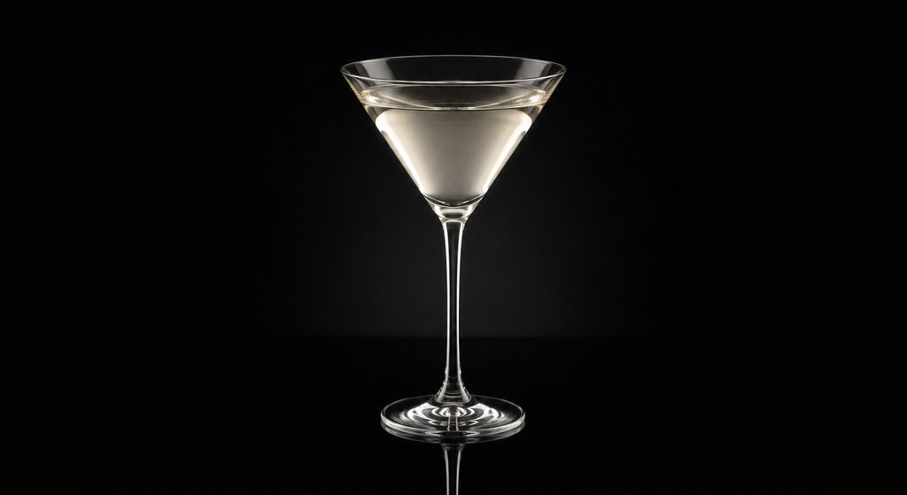 Dickens' Dry Martini cocktail on a dark studio background