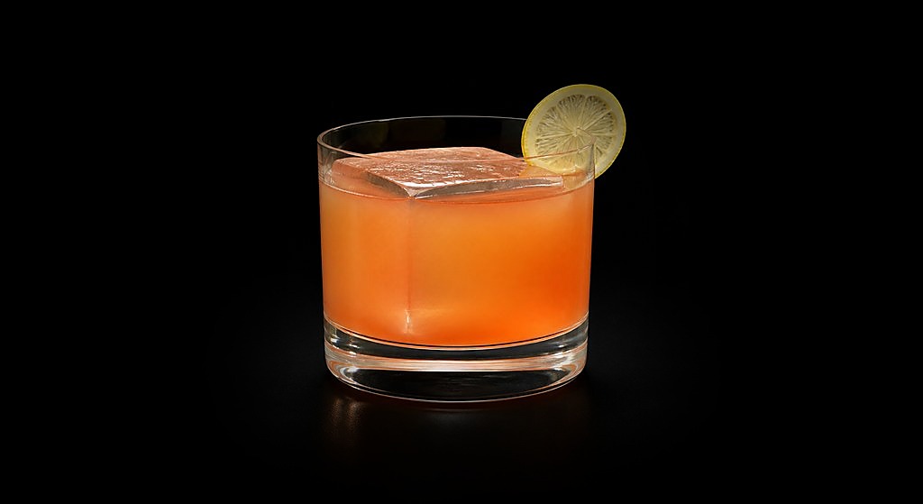 Disco Tiger cocktail on a dark studio background