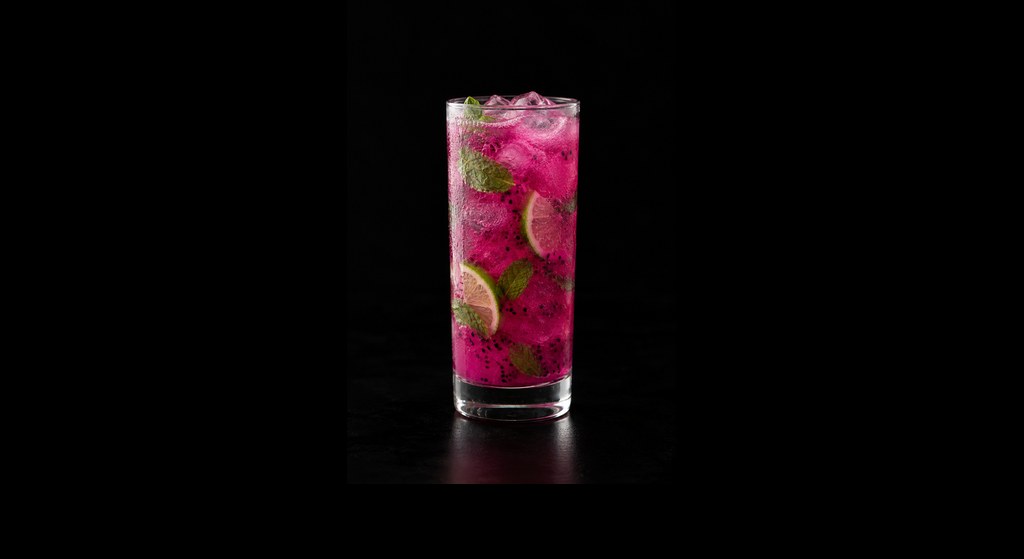 Dragon Fruit Mojito Mocktail cocktail on a dark studio background