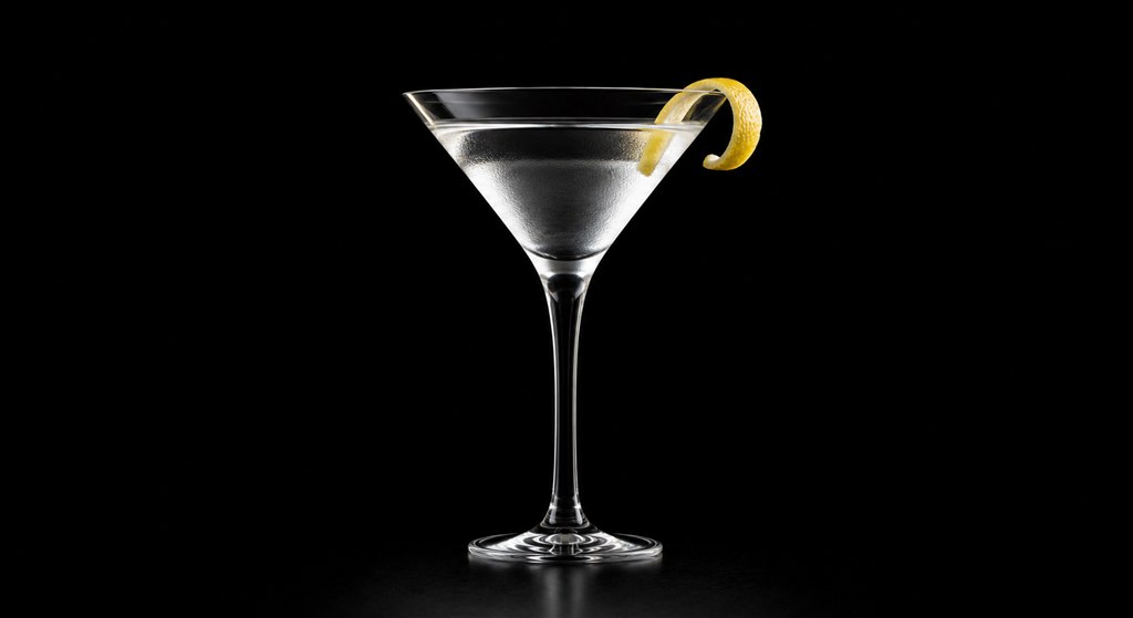 Classic Dry Martini in a martini glass on a black background