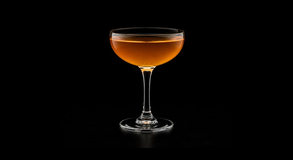 Elder Fashioned cocktail on a dark studio background