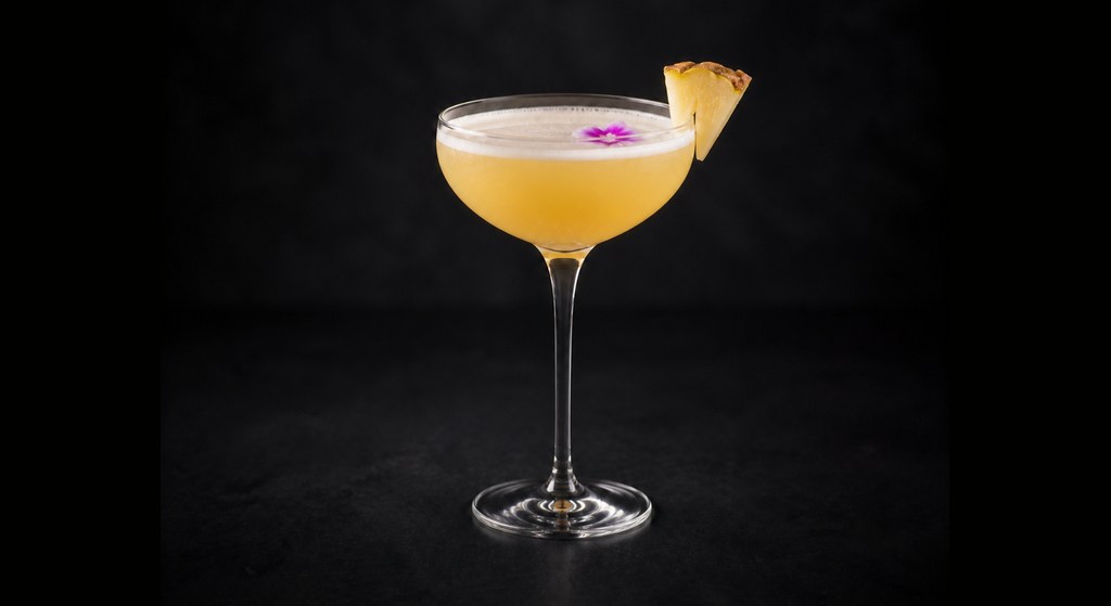 Elusive Dreams cocktail on a dark studio background