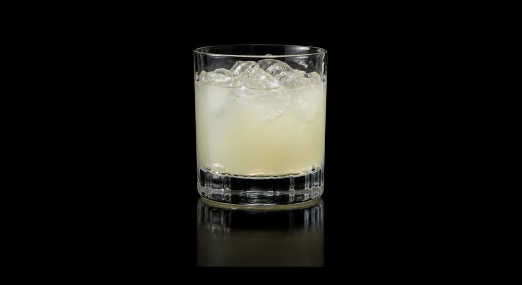 Employees Only's Mezcal Margarita cocktail on a dark studio background