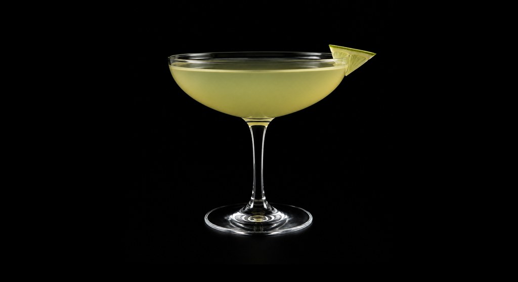 Esmeralda cocktail on a dark studio background