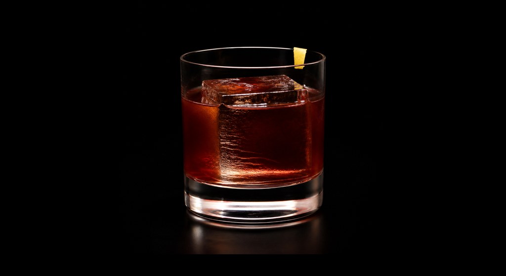 Few Words cocktail on a dark studio background