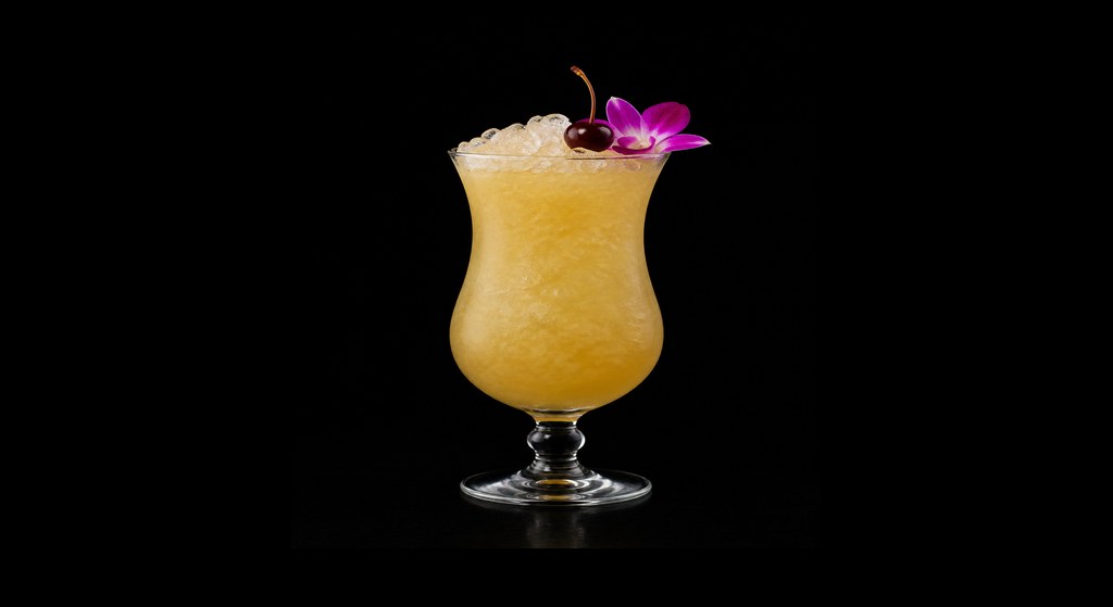 The Finer Points of Bad Behavior cocktail on a dark studio background