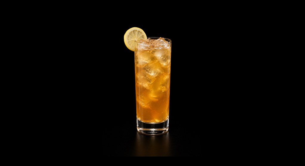 Fish House Punch cocktail on a dark studio background