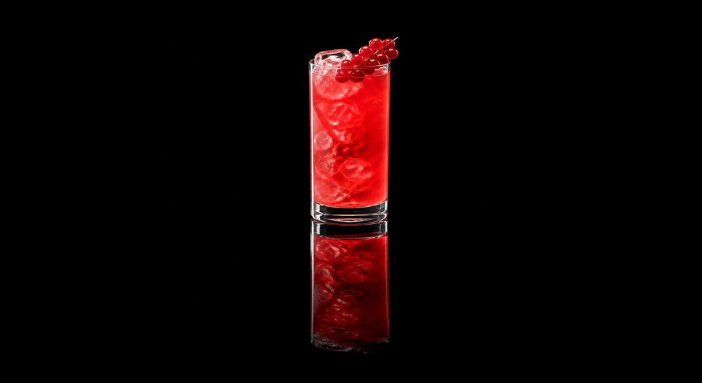 Florida Sling cocktail on a dark studio background
