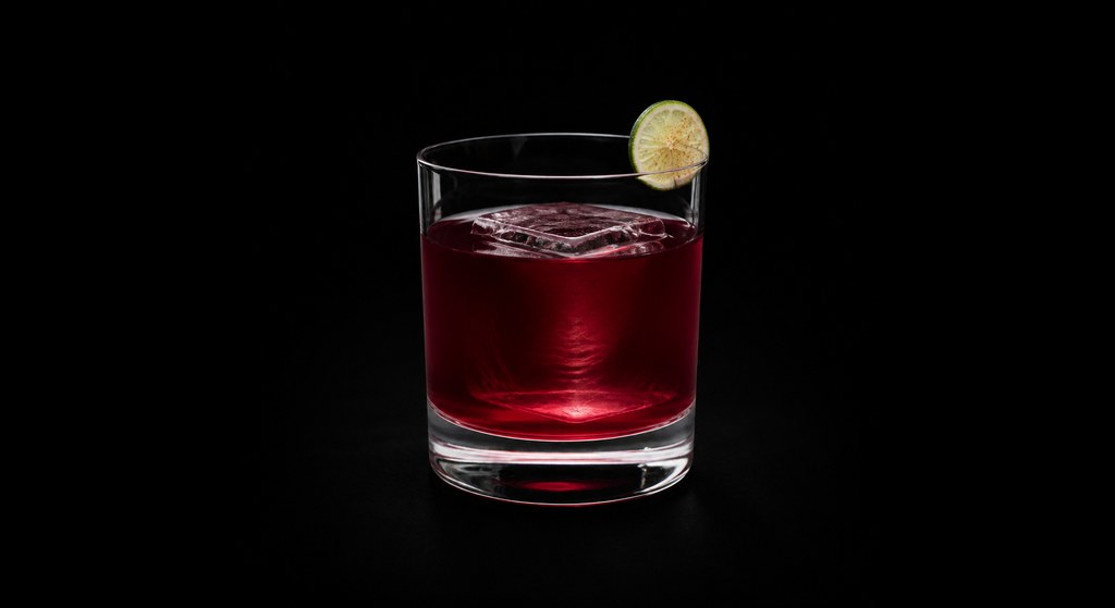 Forever Dusk cocktail on a dark studio background