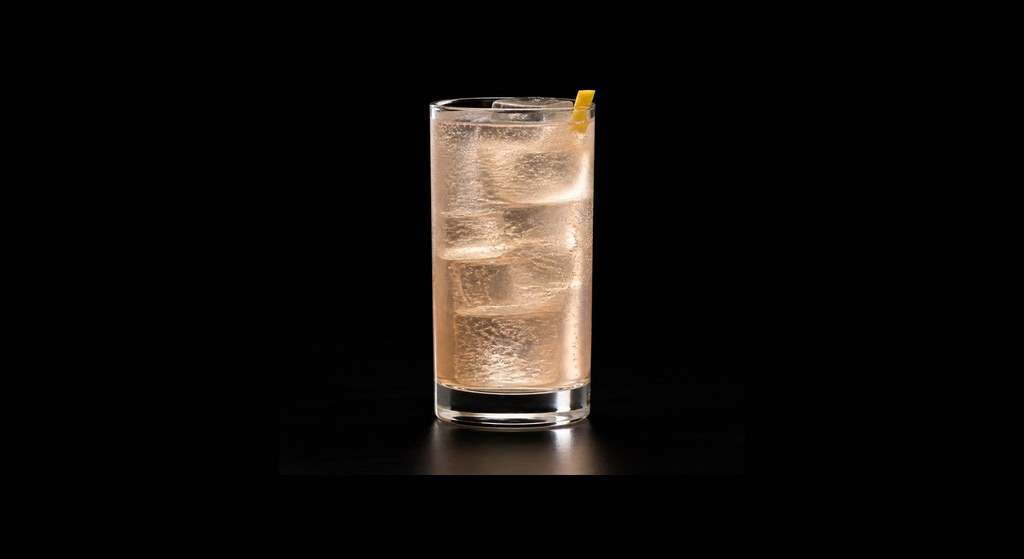 French 75 (Difford's recipe) cocktail on a dark studio background
