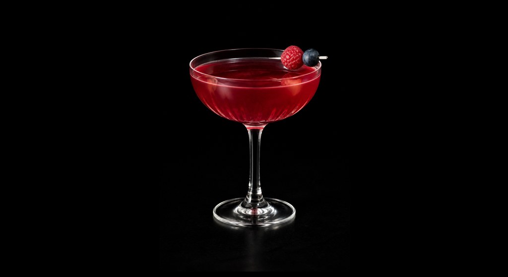 French Berry cocktail on a dark studio background