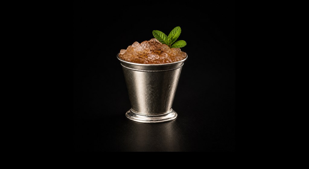 French Impressions cocktail on a dark studio background