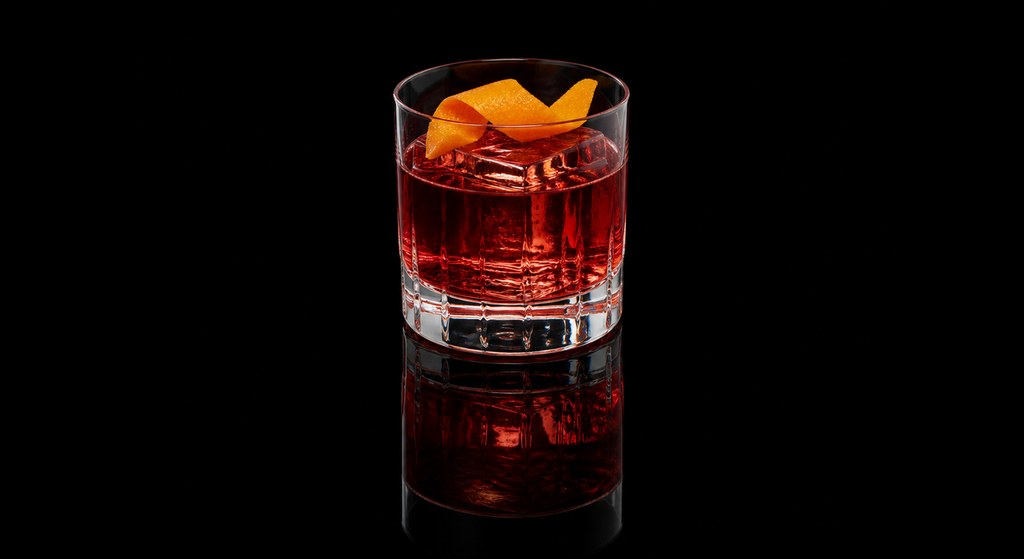 Frenchi Negroni cocktail on a dark studio background