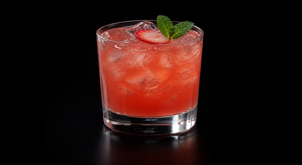 Fresa Fresca cocktail on a dark studio background