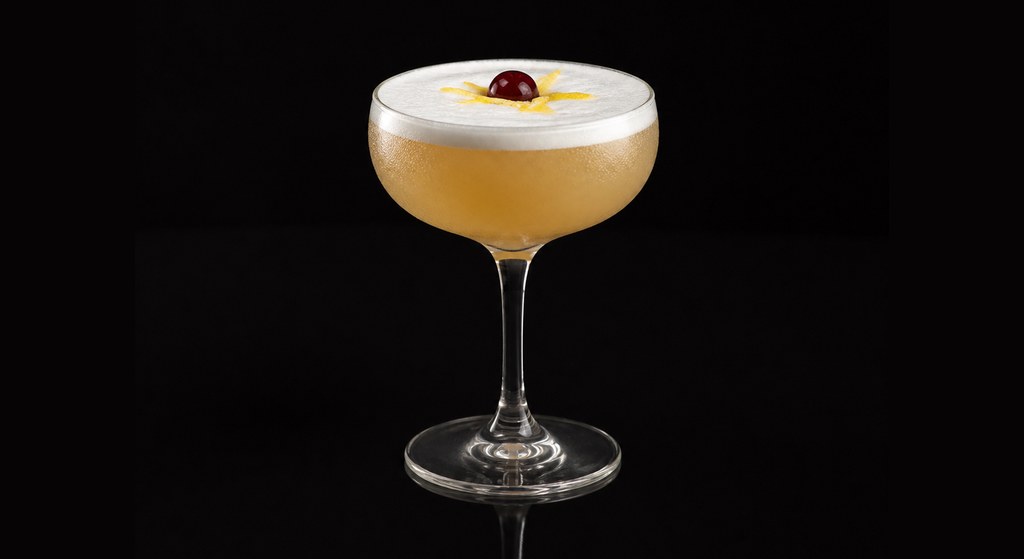 Frisco Sour cocktail on a dark studio background