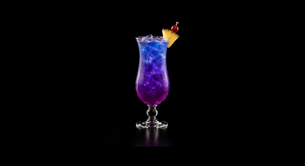 Fruit Tingle cocktail on a dark studio background