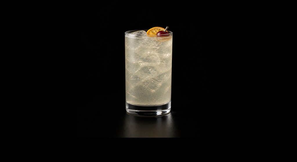 Genever Collins cocktail on a dark studio background