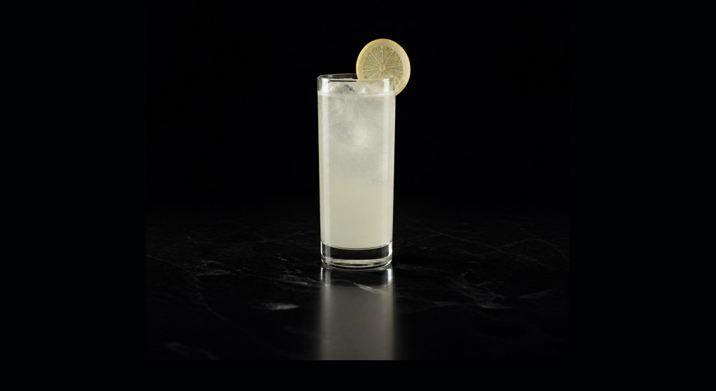 Gin Fizz cocktail on a dark studio background