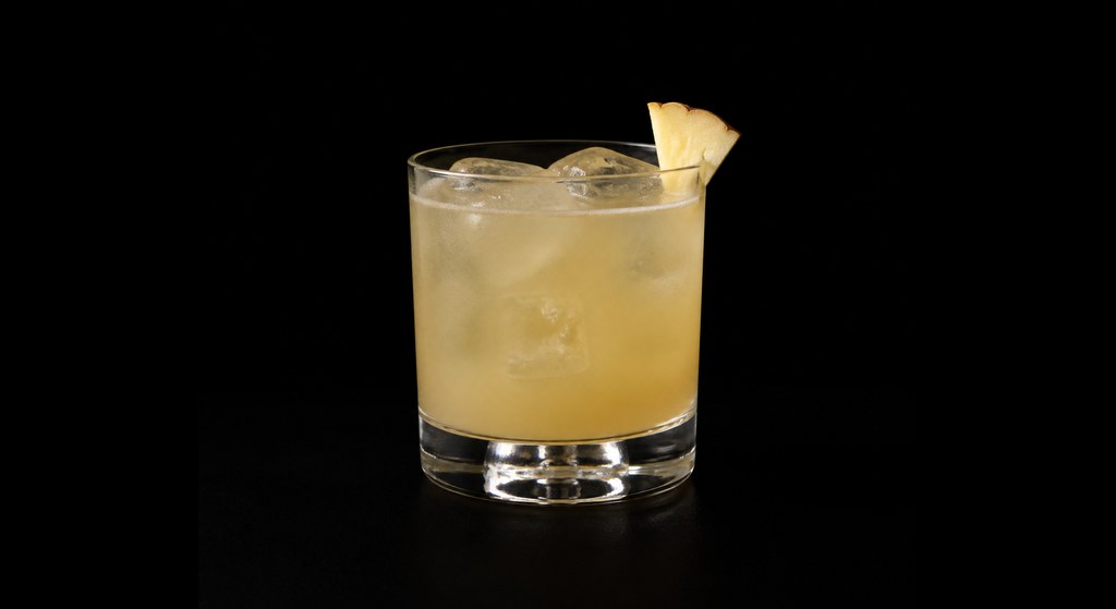 Gin Mezcal Sour cocktail on a dark studio background