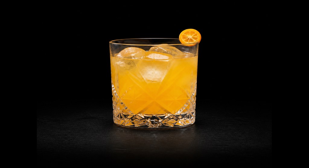 Gin Stone Sour cocktail on a dark studio background