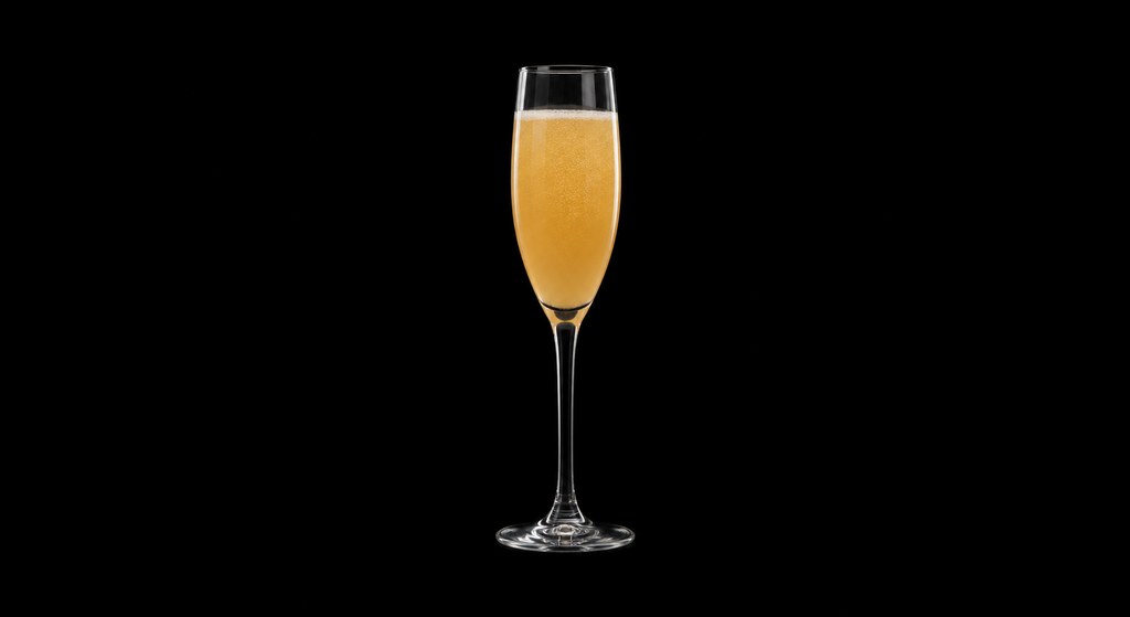 Ginger Bellini cocktail on a dark studio background
