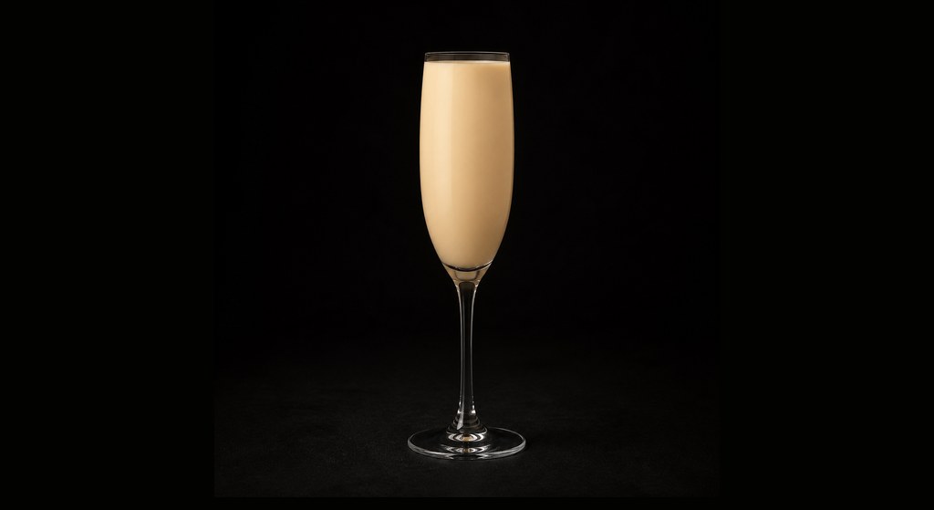 Godchild cocktail on a dark studio background