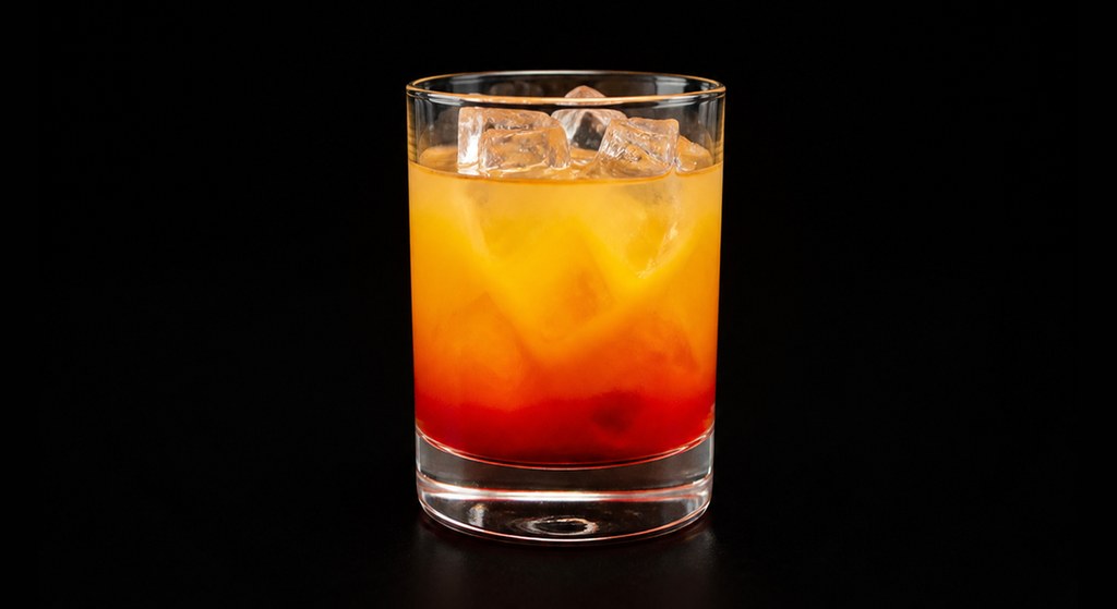 Golden Dawn cocktail on a dark studio background