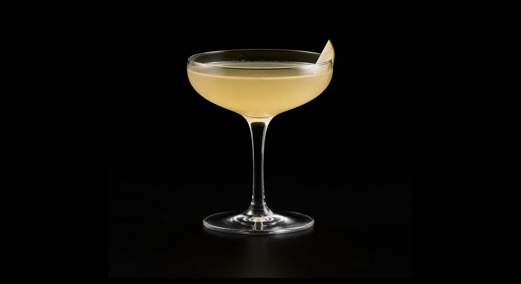 Golden Orchard cocktail on a dark studio background