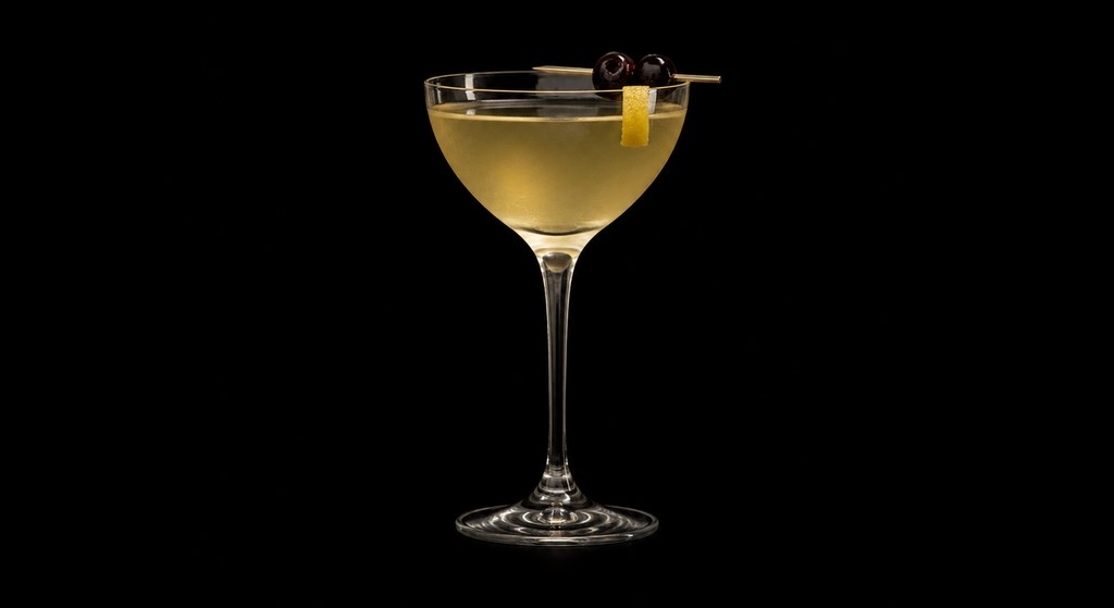 Golden Phone cocktail on a dark studio background
