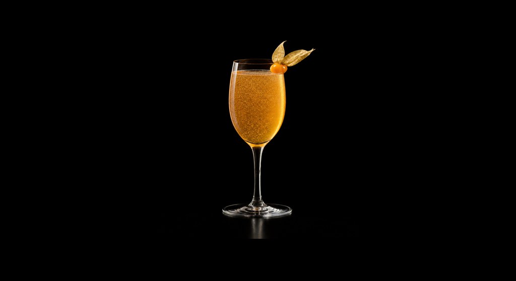 Golden Screw cocktail on a dark studio background