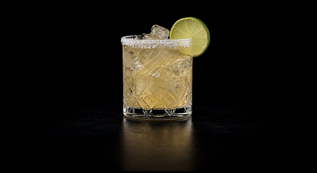 Grand Margarita cocktail on a dark studio background