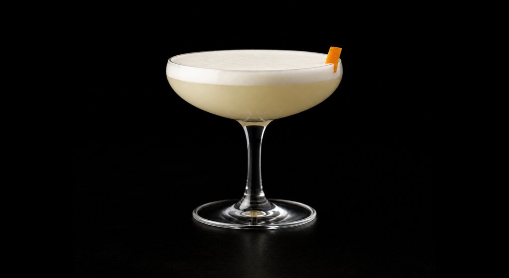Grand White Lady cocktail on a dark studio background