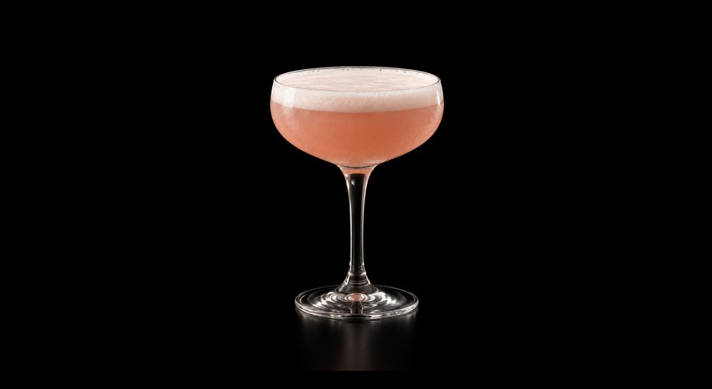 Grapefruit MartiNO cocktail on a dark studio background